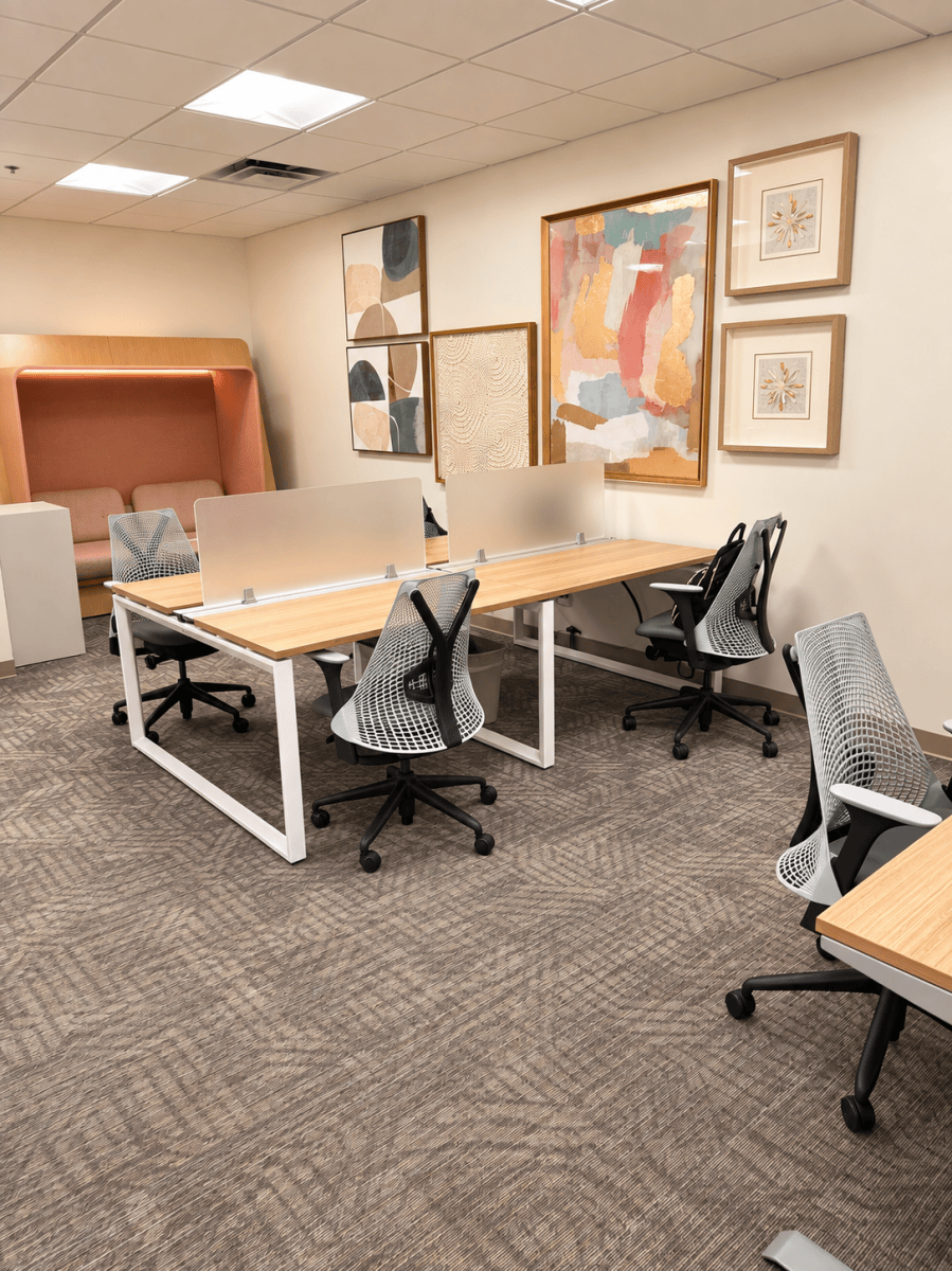 Bright workspace with desks and artwork