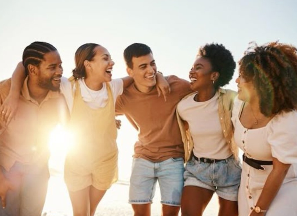 Group of friends laughing together outdoors